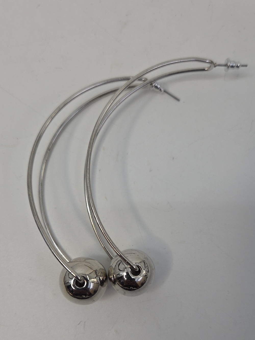 Oversized Silver Hoop Earrings with Polished Ball Accent